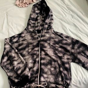 This is a black, metallic Ugg zip up jacket size M